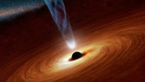 Introduction to the universe and the meaning of the cosmos: This picture depicts black hole surrounded with huge cloud of dust spinning around it. Black holes are the objects in the Universe where the gravity is so strong that it sucks in everything - including light. As even light could not escape a black hole that's why they appear black